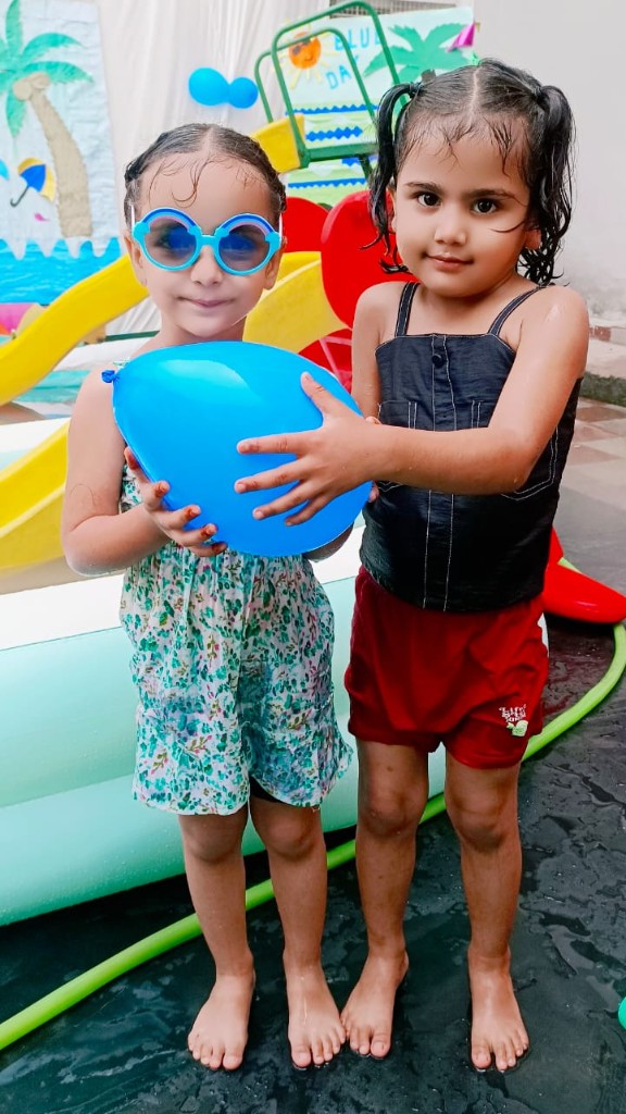 Children with blue balloon during splash day