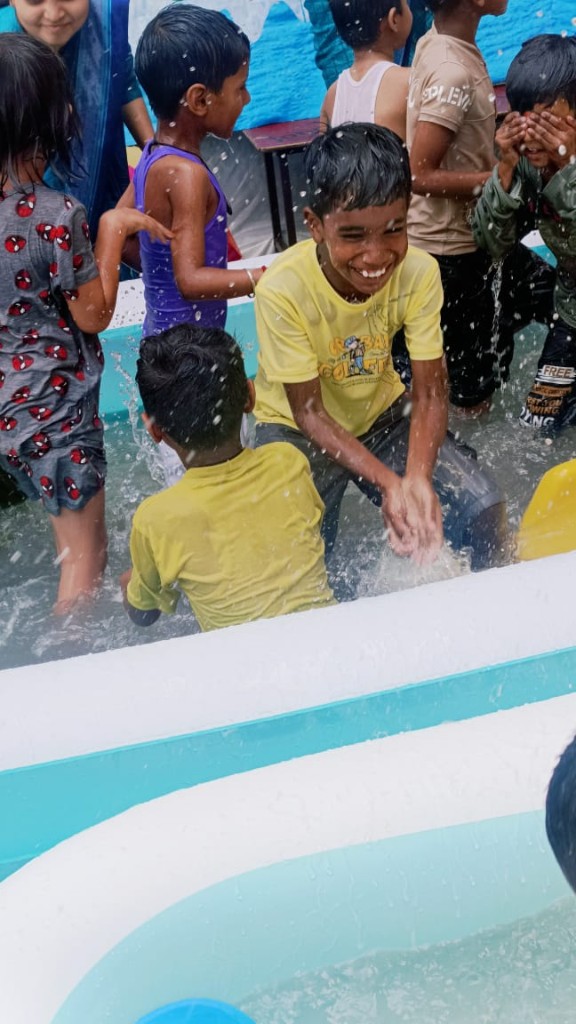 Students playing in water splash activity